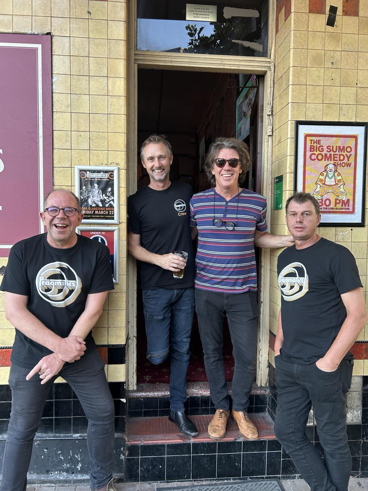The Pragmatics standing outside the Lord Gladstone Hotel in March 2024